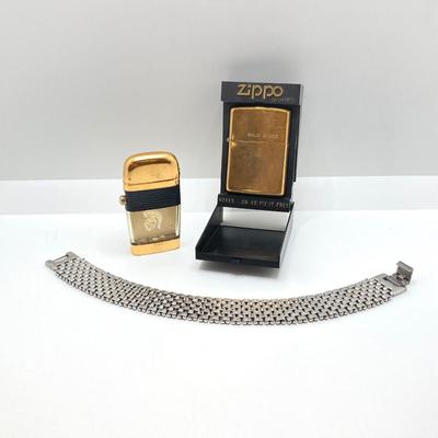 LOT 85: Vintage Lighters and Jewelry - Engraved Brass Zippo, Scripto and Stainless Steel Bracelet