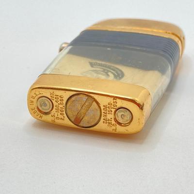 LOT 85: Vintage Lighters and Jewelry - Engraved Brass Zippo, Scripto and Stainless Steel Bracelet