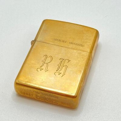 LOT 85: Vintage Lighters and Jewelry - Engraved Brass Zippo, Scripto and Stainless Steel Bracelet