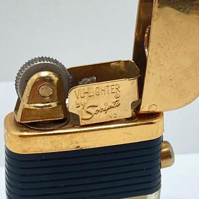 LOT 85: Vintage Lighters and Jewelry - Engraved Brass Zippo, Scripto and Stainless Steel Bracelet