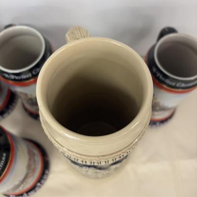 LOT 114: Vintage Western Germany Stein (1.5 liters) & 1992 Budweiser Christmas Steins (5)