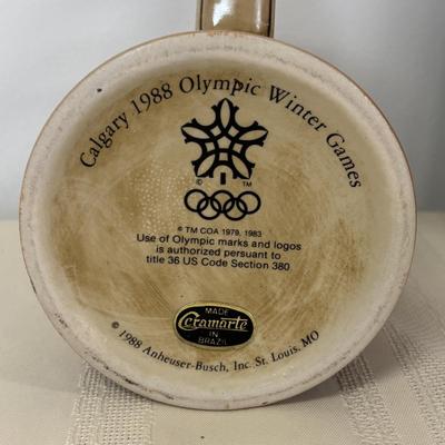 LOT 118: Set of Centennial Celebration The Olympiad Greatest Moments Poster Collection & Calgary 1988 Winter Olympic Winter Games Stein
