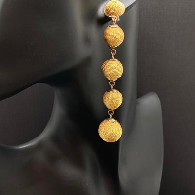 LOT 120: Gold Tone Hand Jewelry / Ring Holder with Collection of Earrings - Kenneth Cole, Baublebar and More