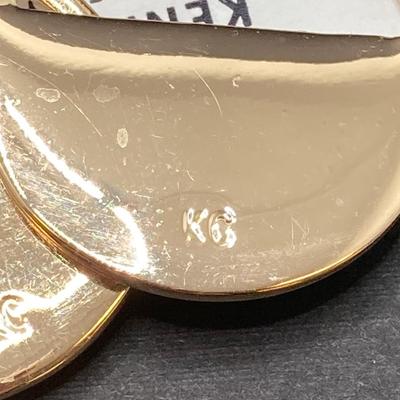 LOT 120: Gold Tone Hand Jewelry / Ring Holder with Collection of Earrings - Kenneth Cole, Baublebar and More