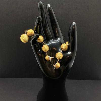 LOT 120: Gold Tone Hand Jewelry / Ring Holder with Collection of Earrings - Kenneth Cole, Baublebar and More