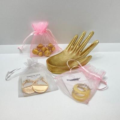 LOT 120: Gold Tone Hand Jewelry / Ring Holder with Collection of Earrings - Kenneth Cole, Baublebar and More
