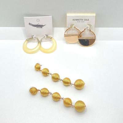 LOT 120: Gold Tone Hand Jewelry / Ring Holder with Collection of Earrings - Kenneth Cole, Baublebar and More