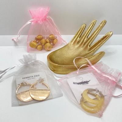LOT 120: Gold Tone Hand Jewelry / Ring Holder with Collection of Earrings - Kenneth Cole, Baublebar and More