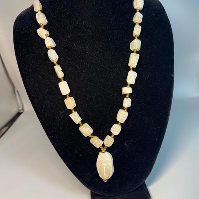 Hand carved soapstone (?) necklace