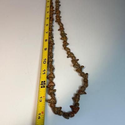 Carved stone necklace