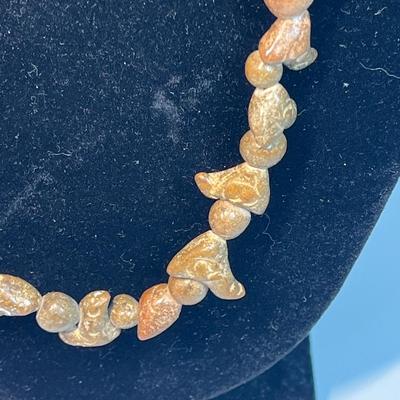 Carved stone necklace