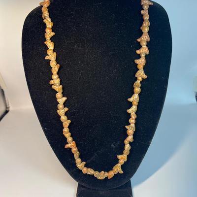 Carved stone necklace