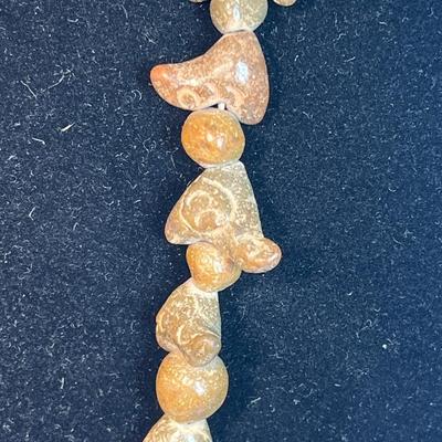 Carved stone necklace