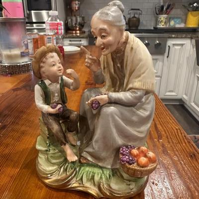 Sale Photo Thumbnail #541: GRANDMA WITH GRANDSON STATUE