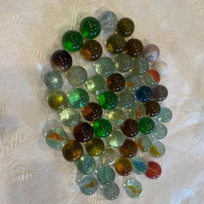 Vintage snuff tin and marbles