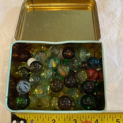 Vintage snuff tin and marbles