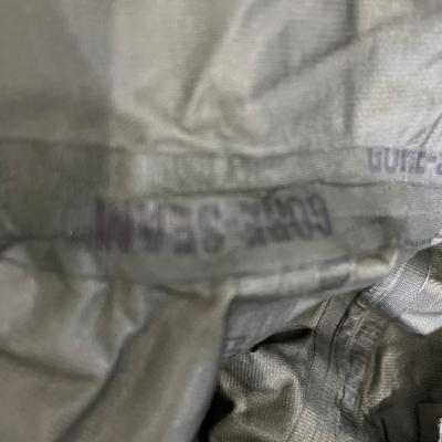 Military issued rain suit and waterproof clothing bag