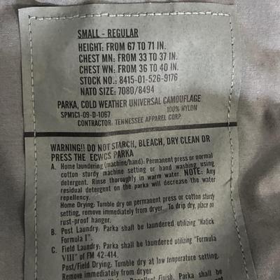 Military issued rain suit and waterproof clothing bag