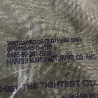 Military issued rain suit and waterproof clothing bag