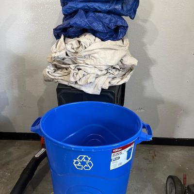 Canvas, painters, tarps, blue plastic tarps, and recycle bin