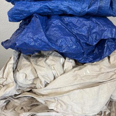 Canvas, painters, tarps, blue plastic tarps, and recycle bin