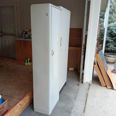 2 METAL STORAGE CABINETS (1 LOCKS WITH KEY)