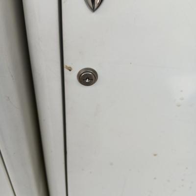 2 METAL STORAGE CABINETS (1 LOCKS WITH KEY)