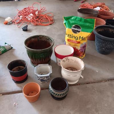 CERAMIC AND CLAY FLOWER POTS PLUS A NEW BAG OF POTTING SOIL