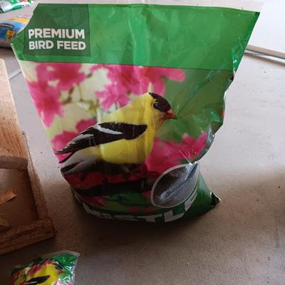 WOODEN FAIRLY LARGE BIRD FEEDER AND THISTLE BIRD SEED