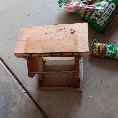 WOODEN FAIRLY LARGE BIRD FEEDER AND THISTLE BIRD SEED