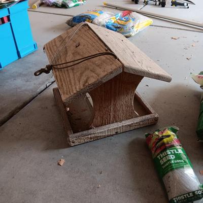 WOODEN FAIRLY LARGE BIRD FEEDER AND THISTLE BIRD SEED