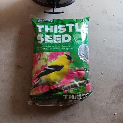 NEW SQUIRREL RESISTANT BIRD FEEDER AND A BAG OF THISTLE BIRD SEED