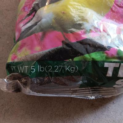 NEW SQUIRREL RESISTANT BIRD FEEDER AND A BAG OF THISTLE BIRD SEED