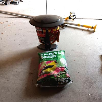 NEW SQUIRREL RESISTANT BIRD FEEDER AND A BAG OF THISTLE BIRD SEED