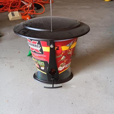 NEW SQUIRREL RESISTANT BIRD FEEDER AND A BAG OF THISTLE BIRD SEED