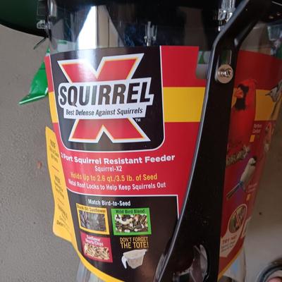 NEW SQUIRREL RESISTANT BIRD FEEDER AND A BAG OF THISTLE BIRD SEED