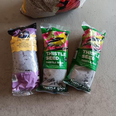 BAG OF SUNFLOWER CHIPS AND 3 THISTLE SEED SOCKS