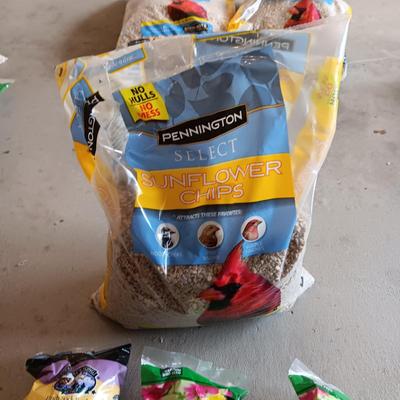 BAG OF SUNFLOWER CHIPS AND 3 THISTLE SEED SOCKS
