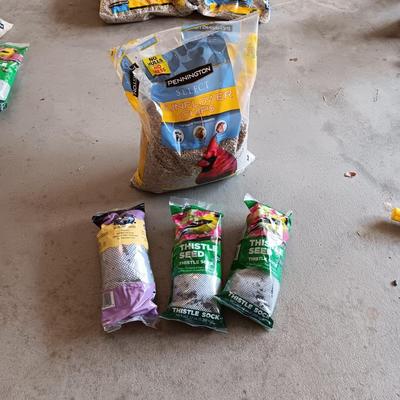 BAG OF SUNFLOWER CHIPS AND 3 THISTLE SEED SOCKS