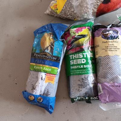 PARTIAL BAG OF SUNFLOWER CHIPS AND THISTLE SEED SOCKS
