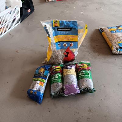 PARTIAL BAG OF SUNFLOWER CHIPS AND THISTLE SEED SOCKS