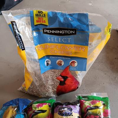 PARTIAL BAG OF SUNFLOWER CHIPS AND THISTLE SEED SOCKS