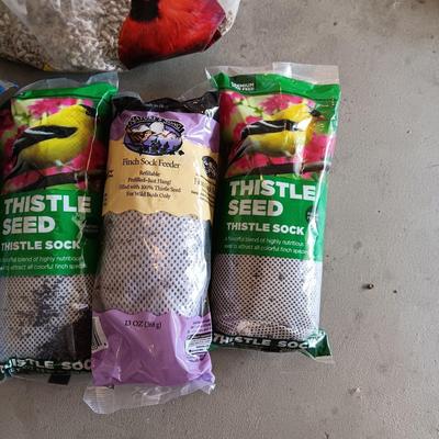 PARTIAL BAG OF SUNFLOWER CHIPS AND THISTLE SEED SOCKS