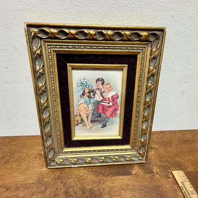 Framed Art: Victorian Style Image of Children Dressing a Dog