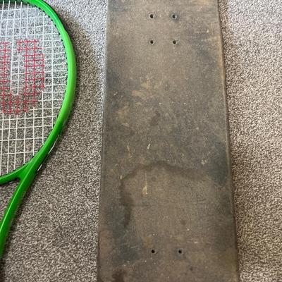 Skateboard and racket