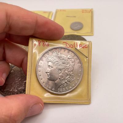 Four Morgan Dollars, a Cincinnati Half Dollar & Capped Bust Half Dime (ST-SS)