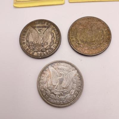 Four Morgan Dollars, a Cincinnati Half Dollar & Capped Bust Half Dime (ST-SS)
