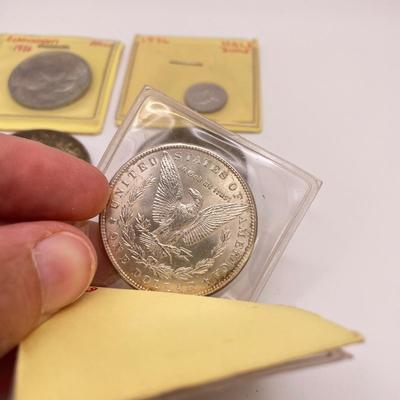 Four Morgan Dollars, a Cincinnati Half Dollar & Capped Bust Half Dime (ST-SS)