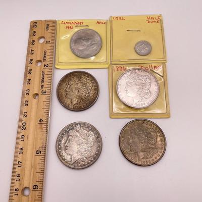 Four Morgan Dollars, a Cincinnati Half Dollar & Capped Bust Half Dime (ST-SS)