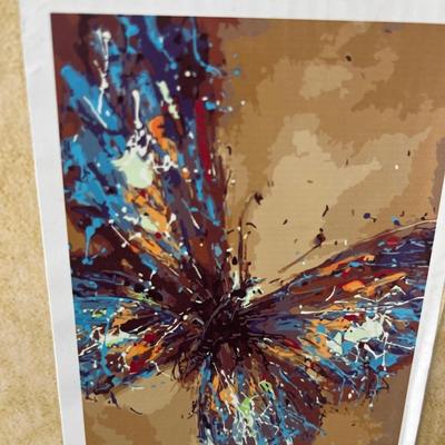 Paint by numbers kit, one canvas, and four painted canvases